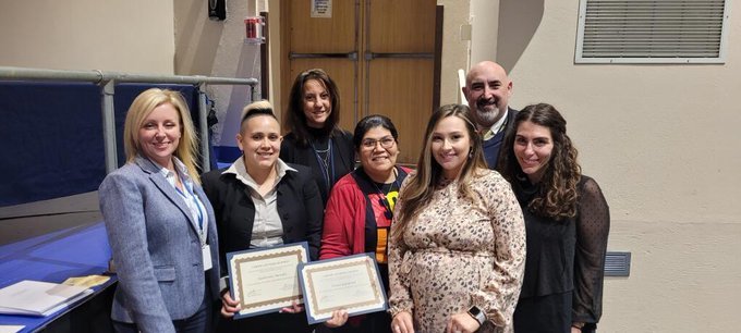 Hornblower staff and Dr. Tomko smiling with certificates